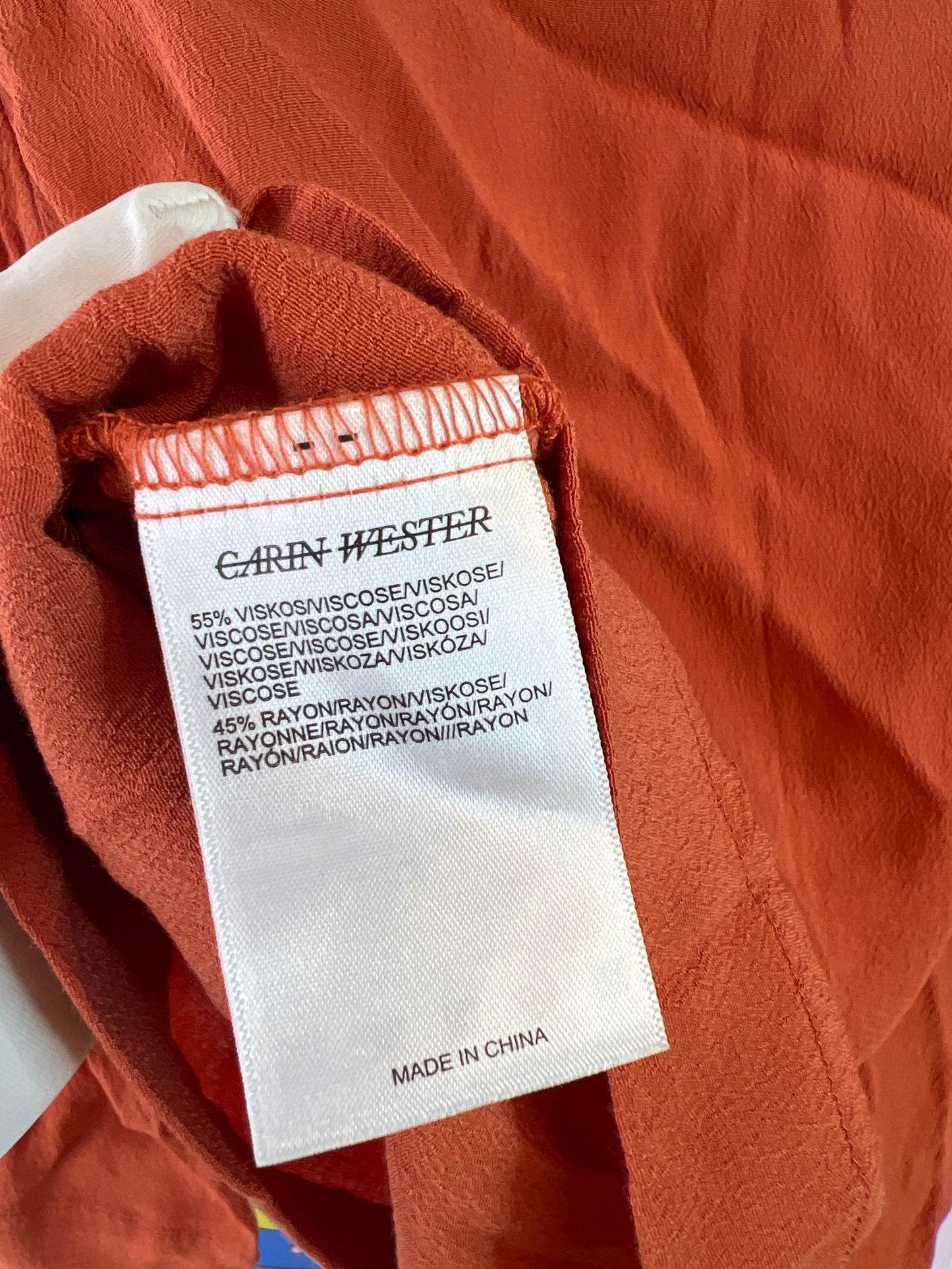 Carin Wester orange top